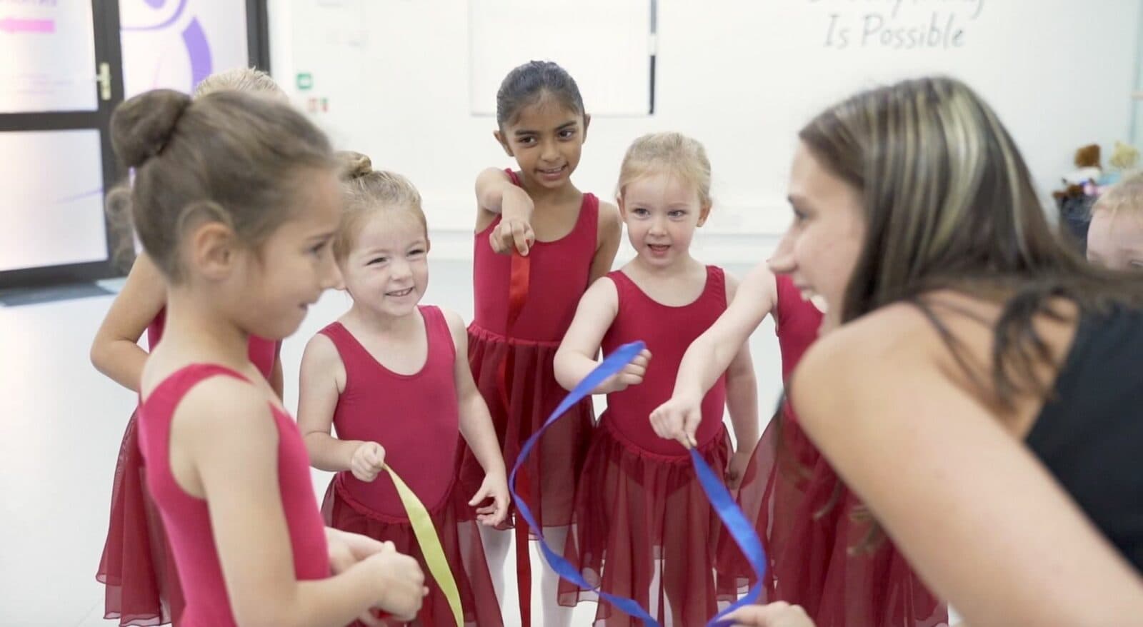 LESTA students in matching red leotards during class in Knaphill
